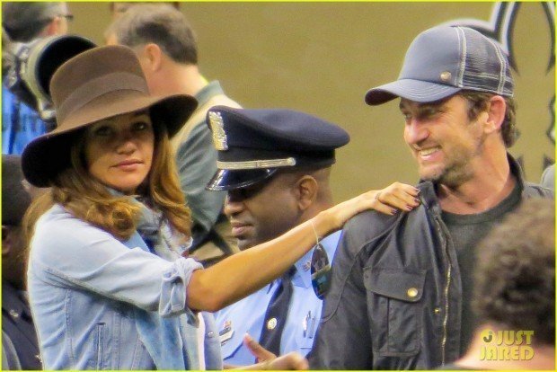 Gerard Butler and girlfriend Morgan Brown attend the New Orleans Saints vs Carolina Panthers football game at the Mercedes Superdome in New Orleans
