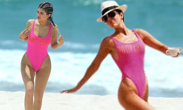 Kylie Jenner wears a hot pink swimsuit while walking on Casa Aramara beach in Mexico MANDITORY MENTION OF "CASA ARAMARA" 