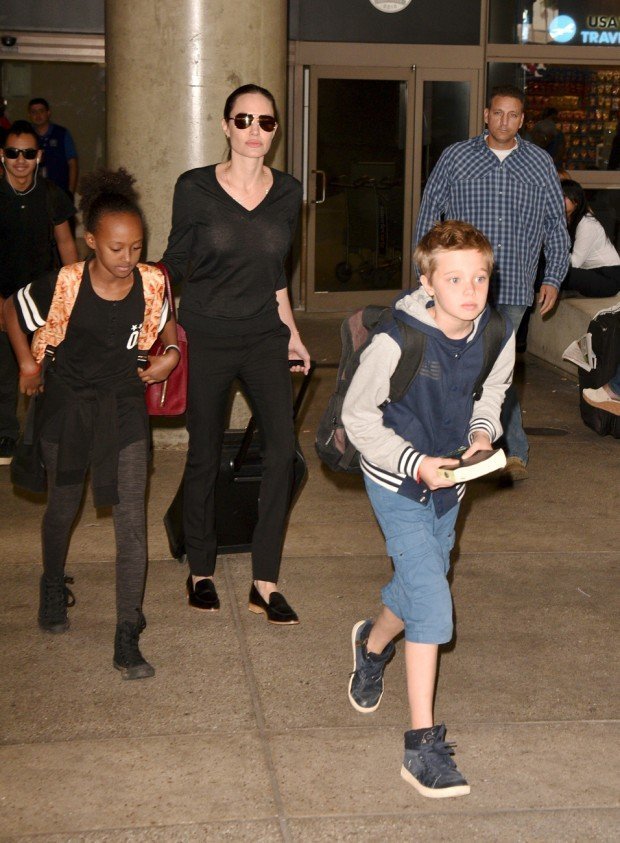 Angelina Jolie arrives at LAX airport in all black with some of her children - Zahara, Pax, Maddox and Shiloh Pictured: Angelina Jolie, Kids Ref: SPL1162927 271015 Picture by: MONEY$HOT / Splash News Splash News and Pictures Los Angeles: 310-821-2666 New York: 212-619-2666 London: 870-934-2666 photodesk@splashnews.com