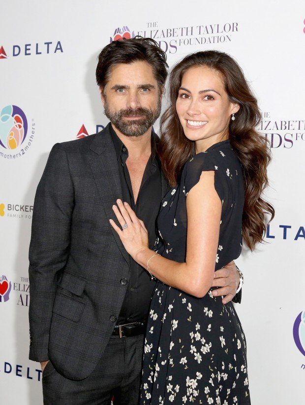 BEVERLY HILLS, CA - OCTOBER 24: (EDITORIAL USE ONLY. NO COMMERCIAL USE) John Stamos (L) and Caitlin McHugh attend The Elizabeth Taylor AIDS Foundation and mothers2mothers dinner at Ron Burkle's Green Acres Estate on October 24, 2017 in Beverly Hills, California. (Photo by Rachel Murray/Getty Images for mothers2mothers and The Elizabeth Taylor AIDS Foundation ) mothers2mothers And The Elizabeth Taylor AIDS Foundation Benefit Dinner At Ron Burkle's Green Acres Estate 2017 Getty Images 775051810 98142498 Getty Images North America Stringer