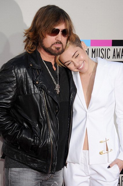 LOS ANGELES, CA - NOVEMBER 24:  Miley Cyrus and Billy Ray Cyrus arrive at the 2013 American Music Awards at Nokia Theatre L.A. Live on November 24, 2013 in Los Angeles, California.  (Photo by Gregg DeGuire/WireImage) 