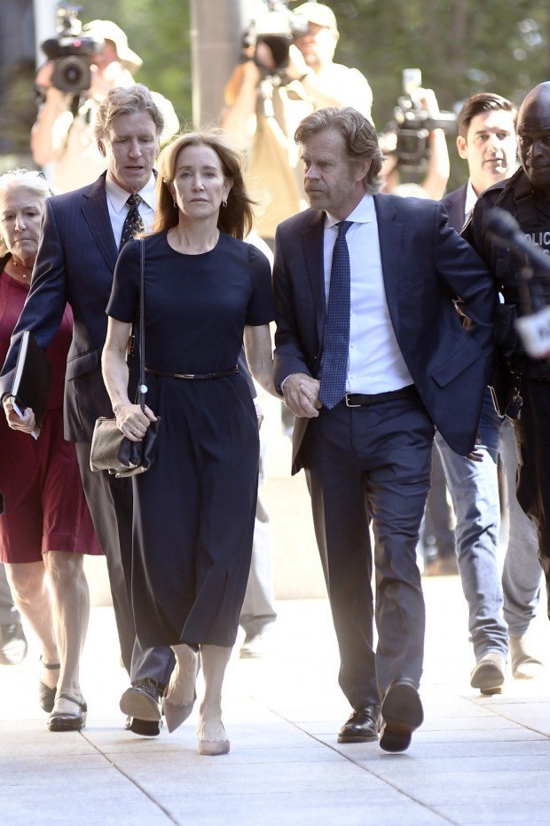 Felicity Huffman and her husband William H Macy arriving at Boston Criminal Court today is her sentencing in the college bribery scandal Pictured: Felicity Huffman,William H Macy Ref: SPL5115589 130919 NON-EXCLUSIVE Picture by: Elder Ordonez / SplashNews.com Splash News and Pictures Los Angeles: 310-821-2666 New York: 212-619-2666 London: +44 (0)20 7644 7656 Berlin: +49 175 3764 166 photodesk@splashnews.com World Rights, No Portugal Rights 